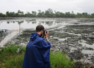 Juraj photographing the oil spill in Goi - packed